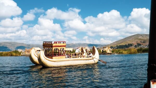 brown and white boat on water during daytime